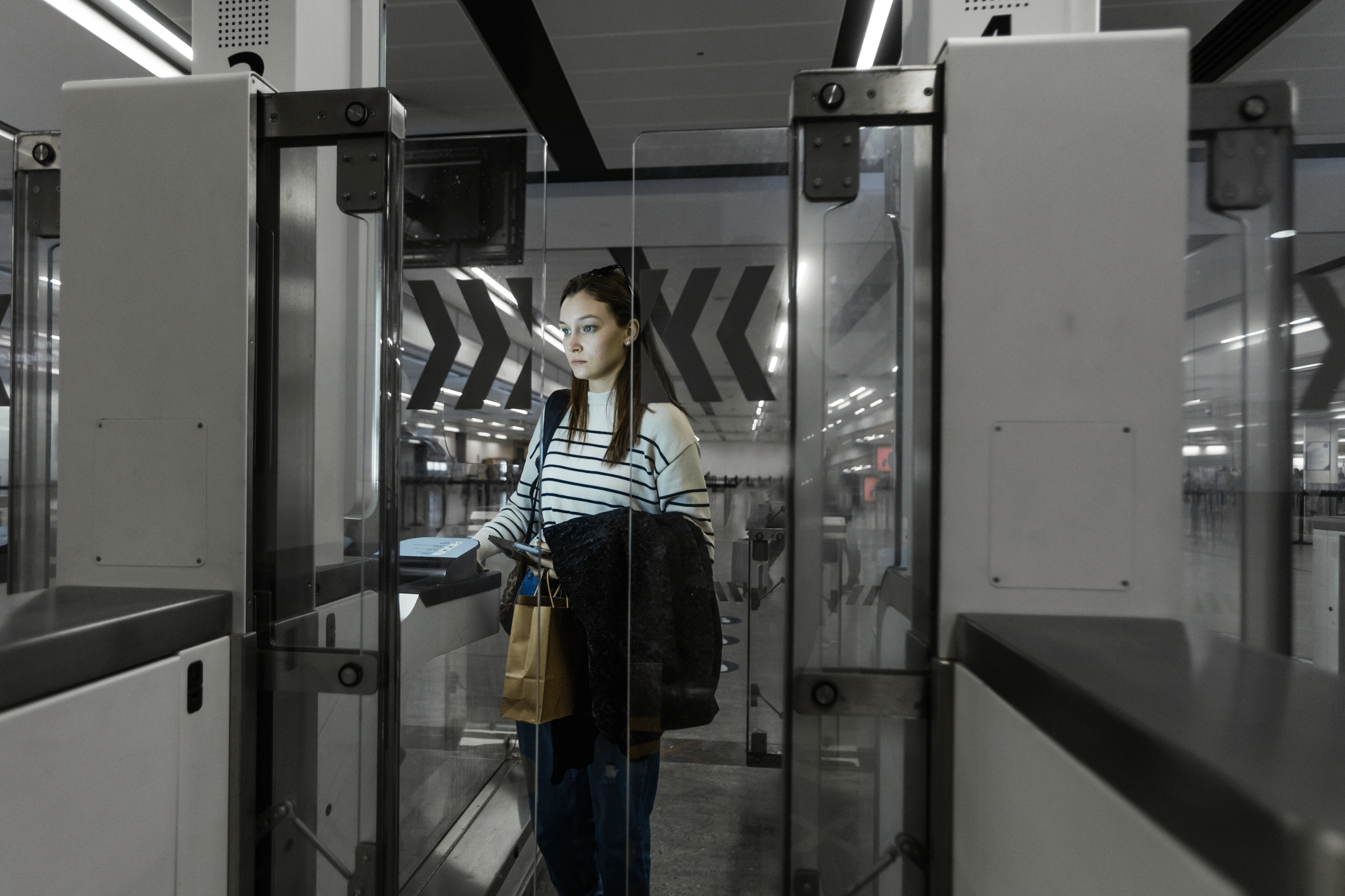 Women going through passport control and immigrating to the UK.