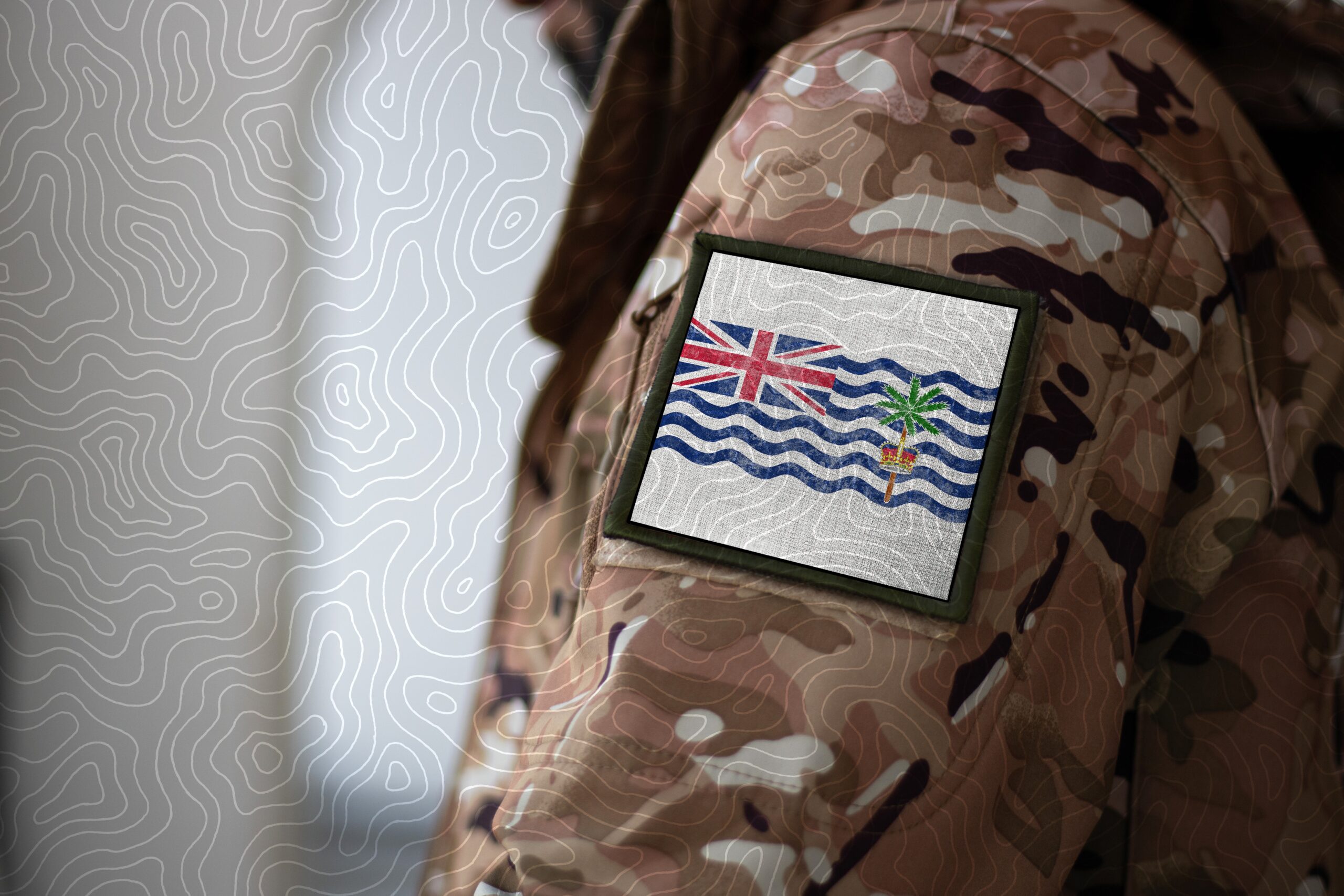 Soldier with flag Commissioner of British Indian Ocean Territory, highlighting the Diego Garcia refugee relocation situation.